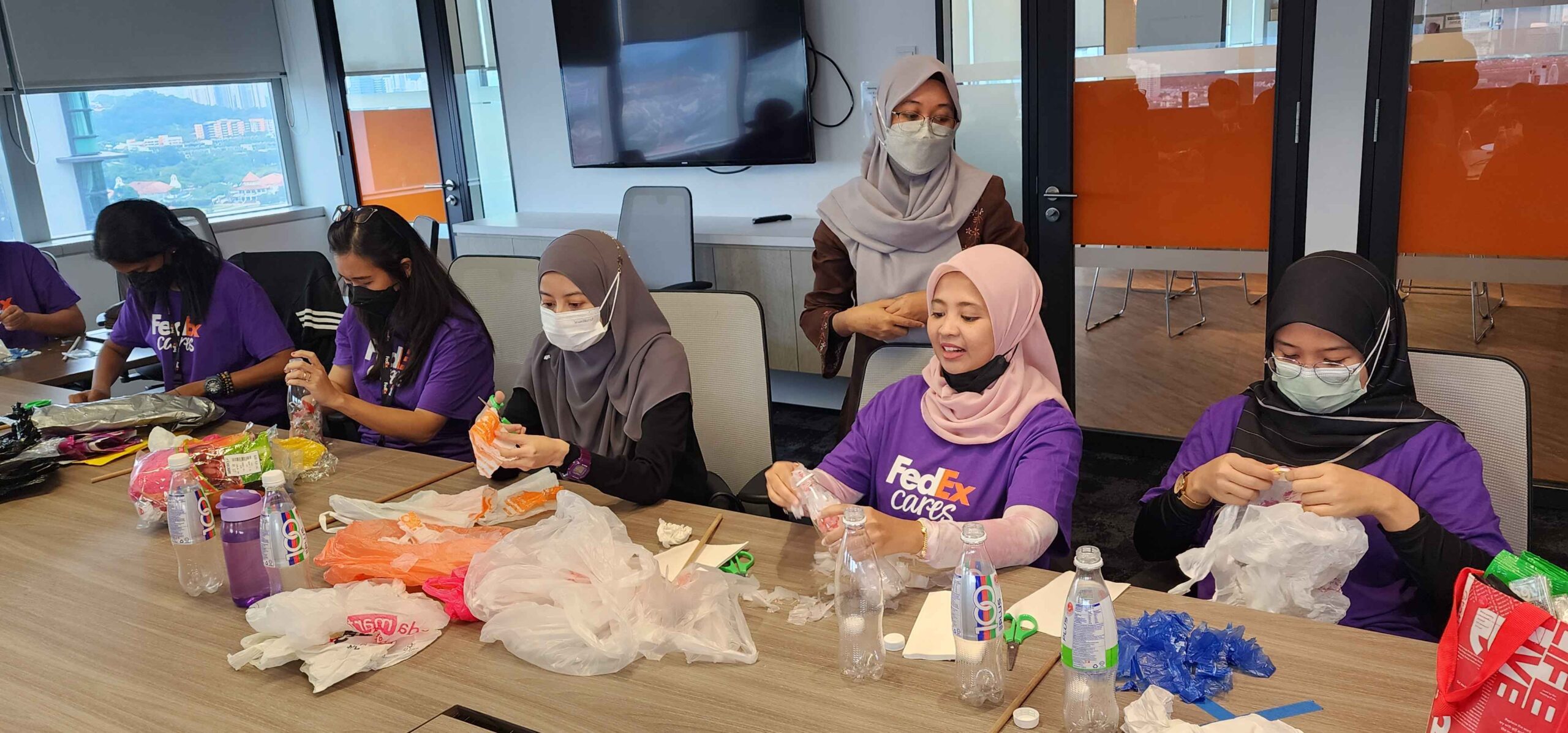 FedEx Cares 2022 - FedEx-Express-Malaysia-volunteers-making-ecobricks-during-the-workshop-organised-by-TrEES-