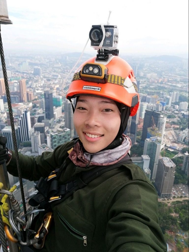 Maya sidek, Malaysia's spider woman, smiling while up on the tower