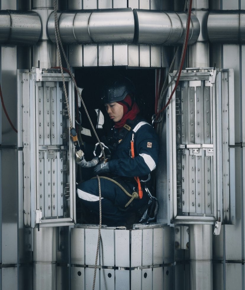 normalia sidek, Malaysia's spider woman, Rope Access Technician, examining the tools for her job