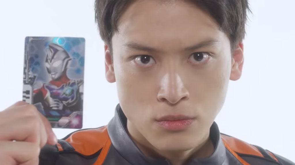 Hiroki Matsumoto holding ultraman decker card