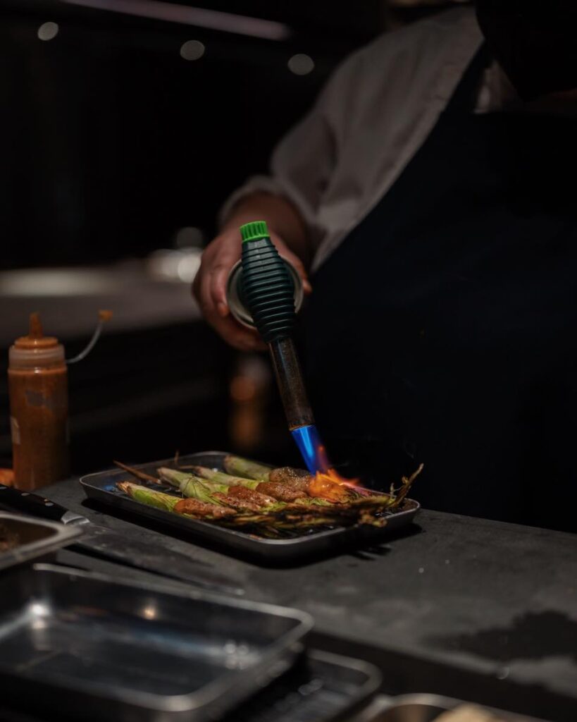 Chef preparing sushi at okaju contemporary restaurant