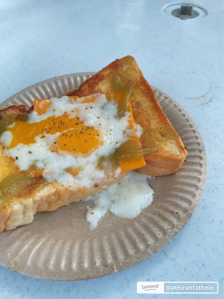 roti kitab with runny eggs for breakfast at kedai kopi nikafe, selangor