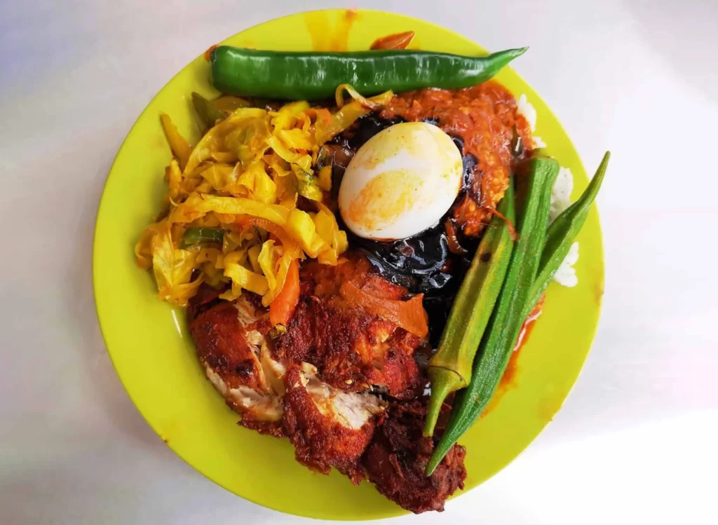 fried chicken, boiled eggs, okra and curry with rice