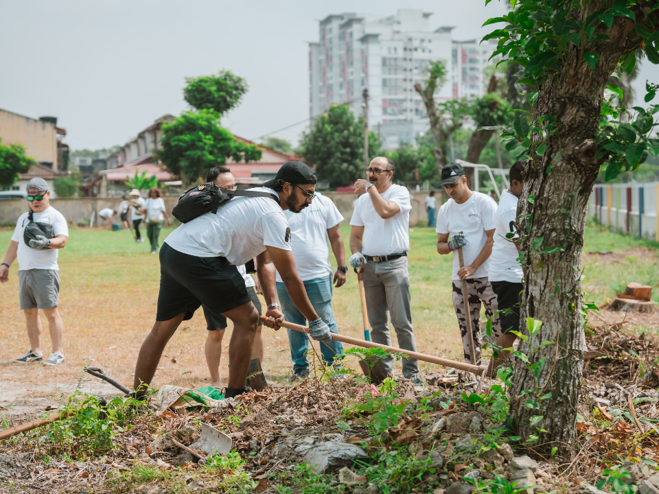 NTT Data employees taking part in revitalizing a school's environment