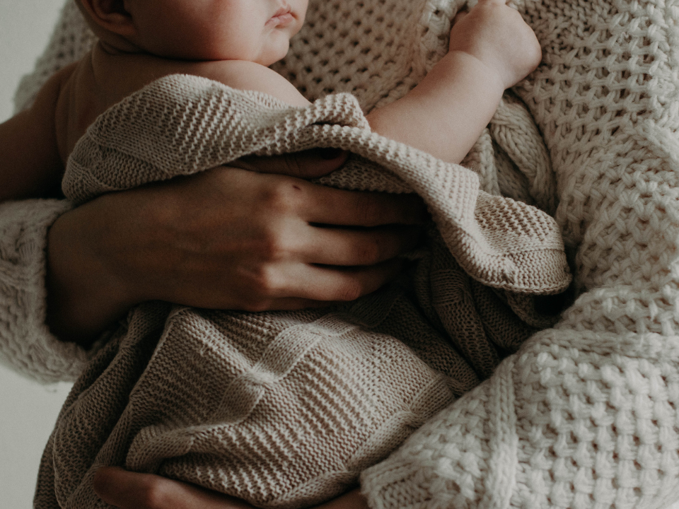 a mother holding a baby