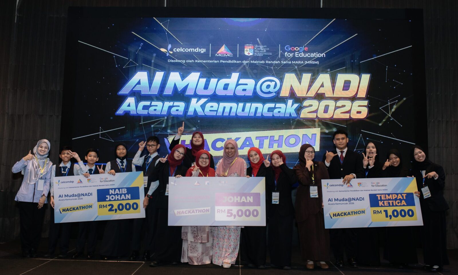 AI Muda@NADI Hackathon 2026 winners on stage with their prize cheques