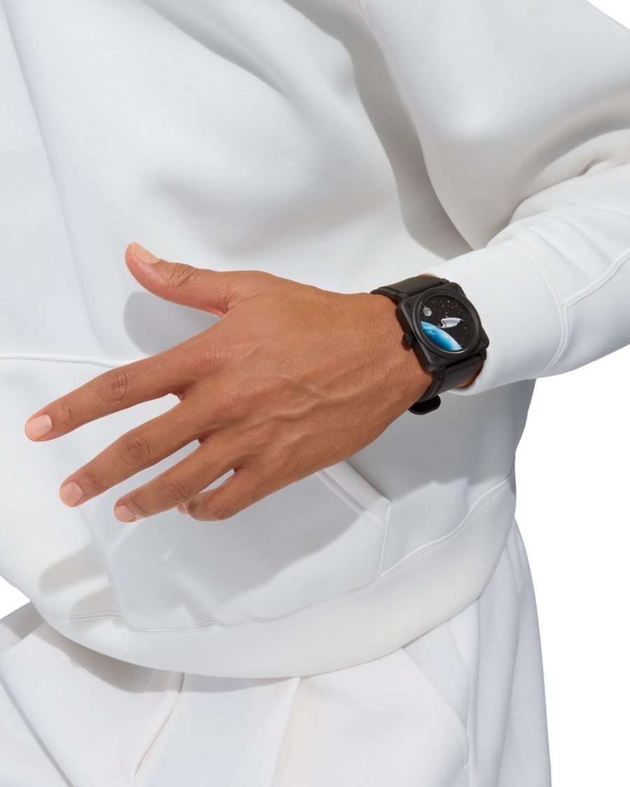 Bell & Ross BR-03 Space Mission black ceramic watch worn with a white hoodie