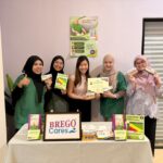Clinic team holding a BREGO Cares certificate of appreciation and bone health screening materials