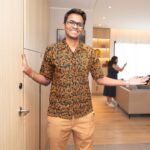 Host welcoming guests to the Home in Malaysia open house at Marriott Executive Apartments Kuala Lumpur