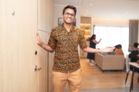 Host welcoming guests to the Home in Malaysia open house at Marriott Executive Apartments Kuala Lumpur