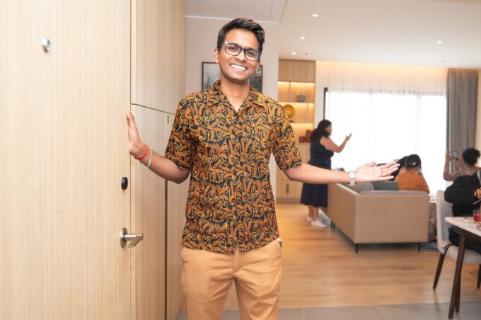 Host welcoming guests to the Home in Malaysia open house at Marriott Executive Apartments Kuala Lumpur