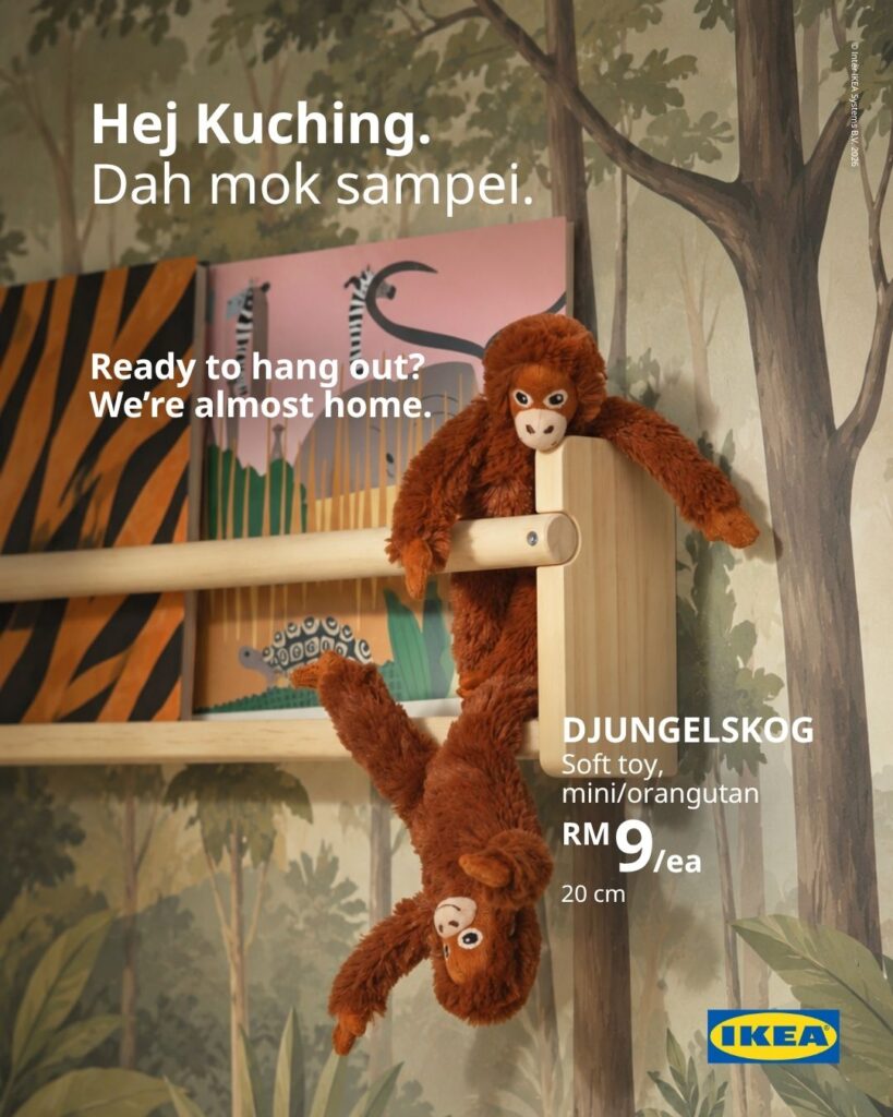 Two IKEA Kuching DJUNGELSKOG mini orangutan soft toys hanging from a wooden children's bookshelf, priced at RM9 each
