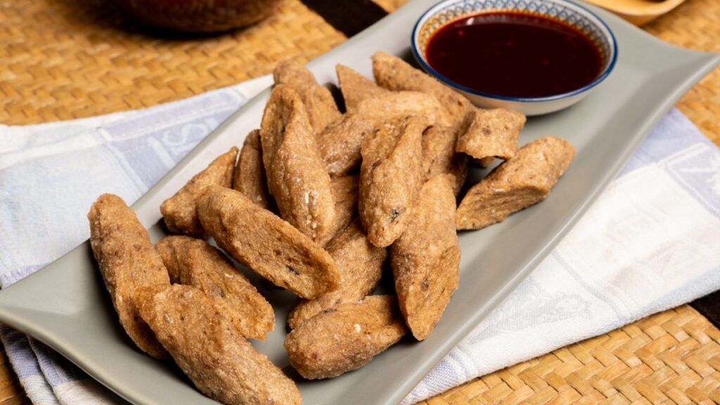 Keropok lekor, a Terengganu East Coast food snack served with chilli sauce