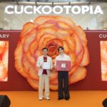 KC Hoe presents the CUCKOO CNY Lifestyle Hamper to Lee Junho at the CUCKOOTOPIA Pop-up