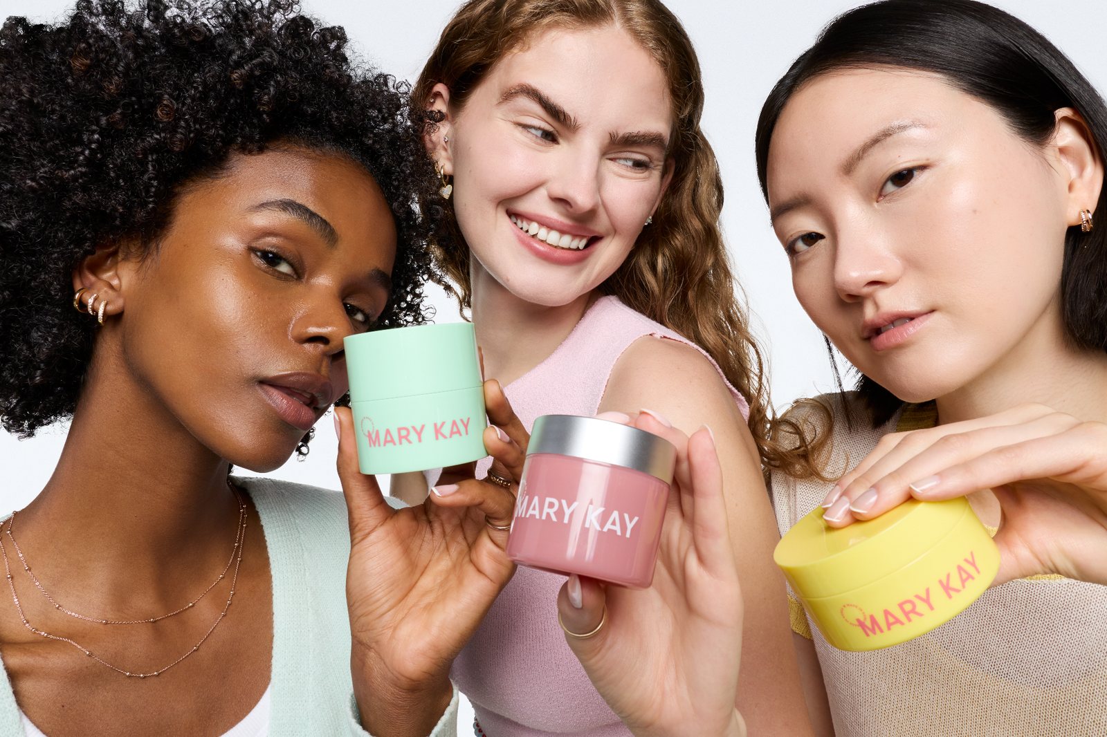 Mary Kay K-Beauty Texture Edit special-edition skincare trio held by three women