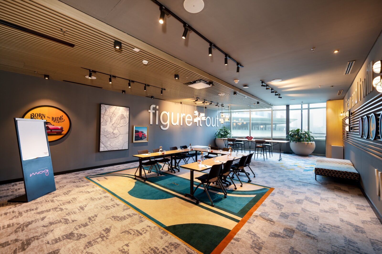 Fun Room 1 at Moxy Putrajaya in a U-shape meeting setup with a high table by the window
