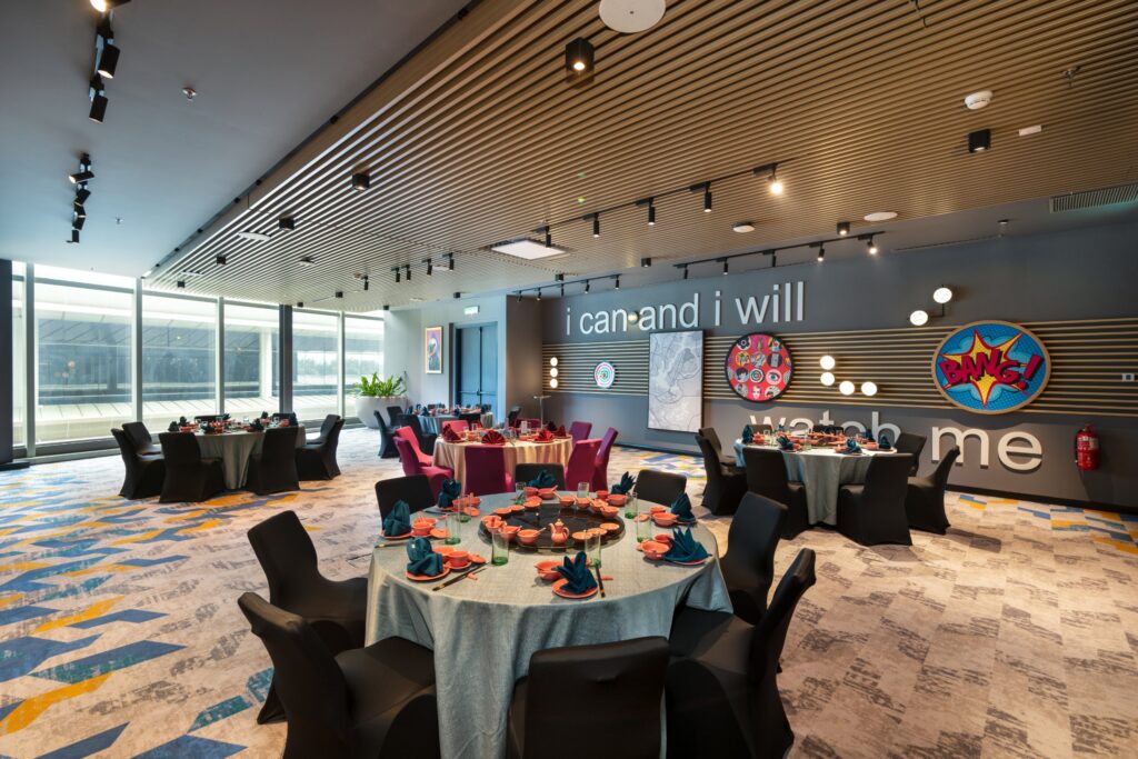 Chinese banquet setup with round tables in Fun Room 3 at Moxy Putrajaya