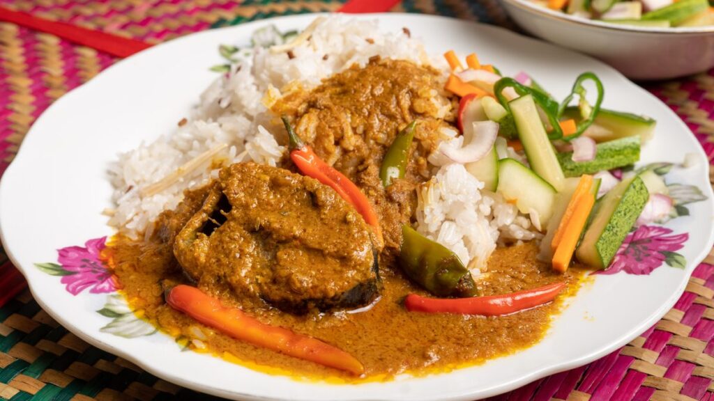 Terengganu nasi dagang with tuna curry and pickled vegetables