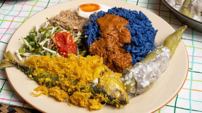 Kelantan nasi kerabu blue rice with ulam, sambal and fried fish, an East Coast food highlight along the ECRL