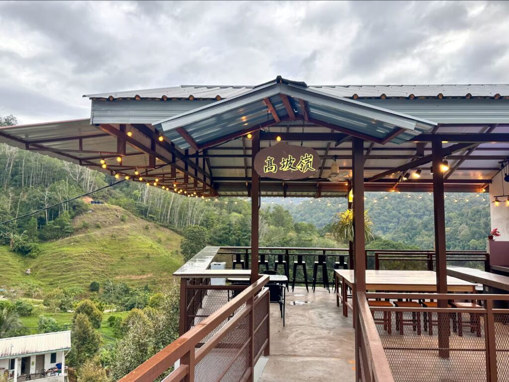 Orchard Homestay deck overlooking the hills, 45 minutes from Kuala Lumpur
