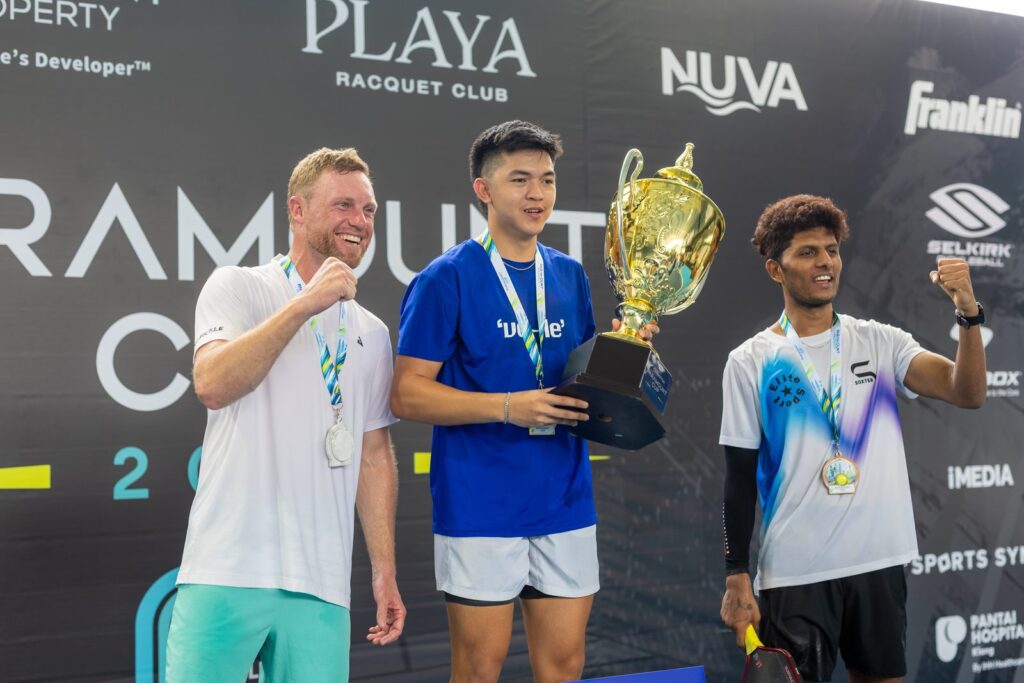 Paramount Cup 2026 champion Patrick Mendoza lifts the Men’s Singles Open trophy