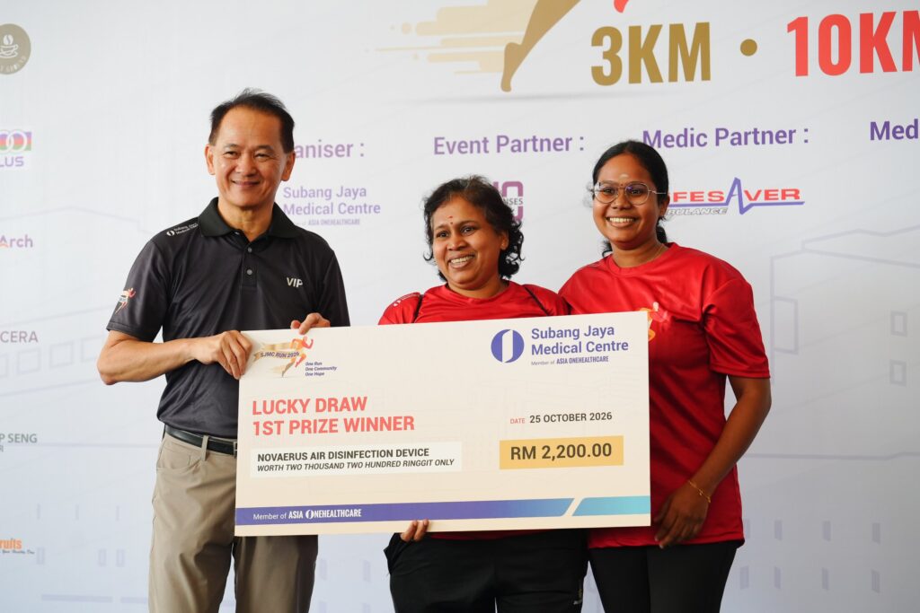 SJMC Run 2026 lucky draw first prize winner receiving a Novaerus air disinfection device