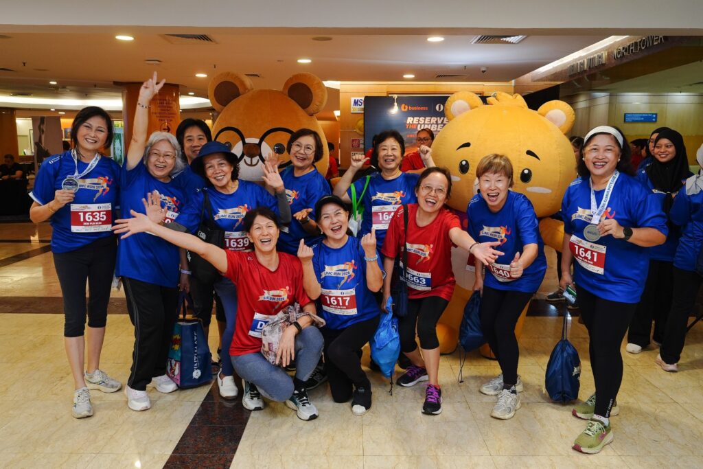 3km fun run participants celebrating with mascots at SJMC Run 2026