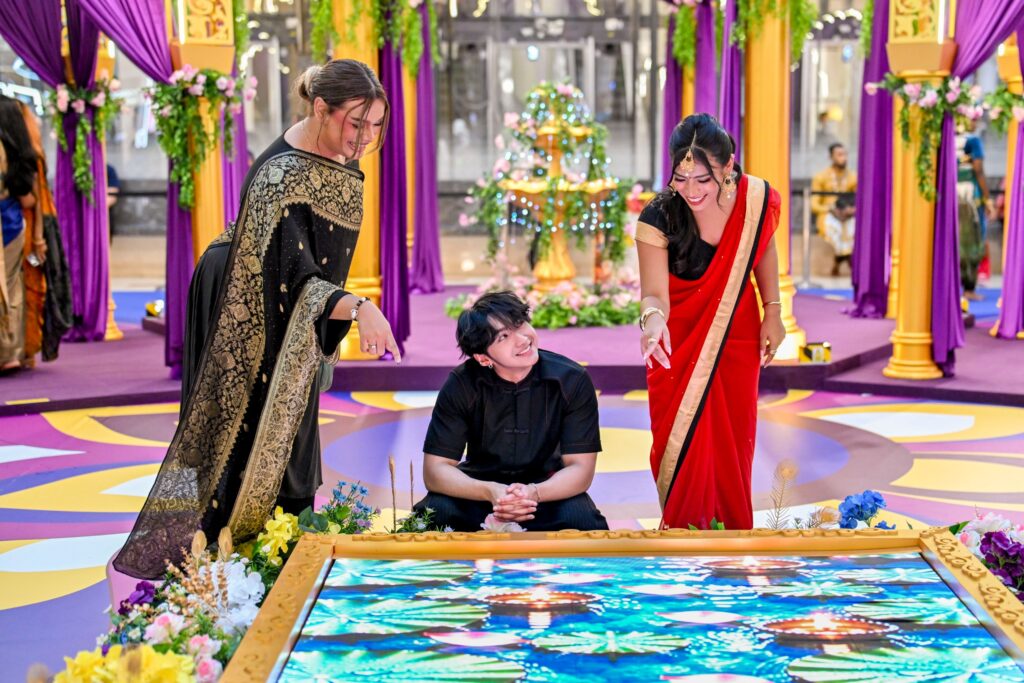 Visitors at the LED water feature of the Suria KLCC Deepavali courtyard