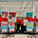 Tambah Satu, Kongsi Satu donation trolleys with Lotus’s Malaysia and Kechara Soup Kitchen representatives