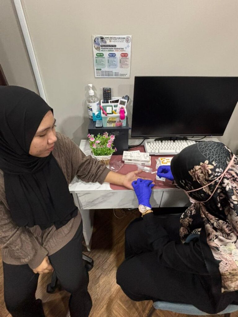 Healthcare worker conducting a Vitamin D fingerstick screening at a participating clinic