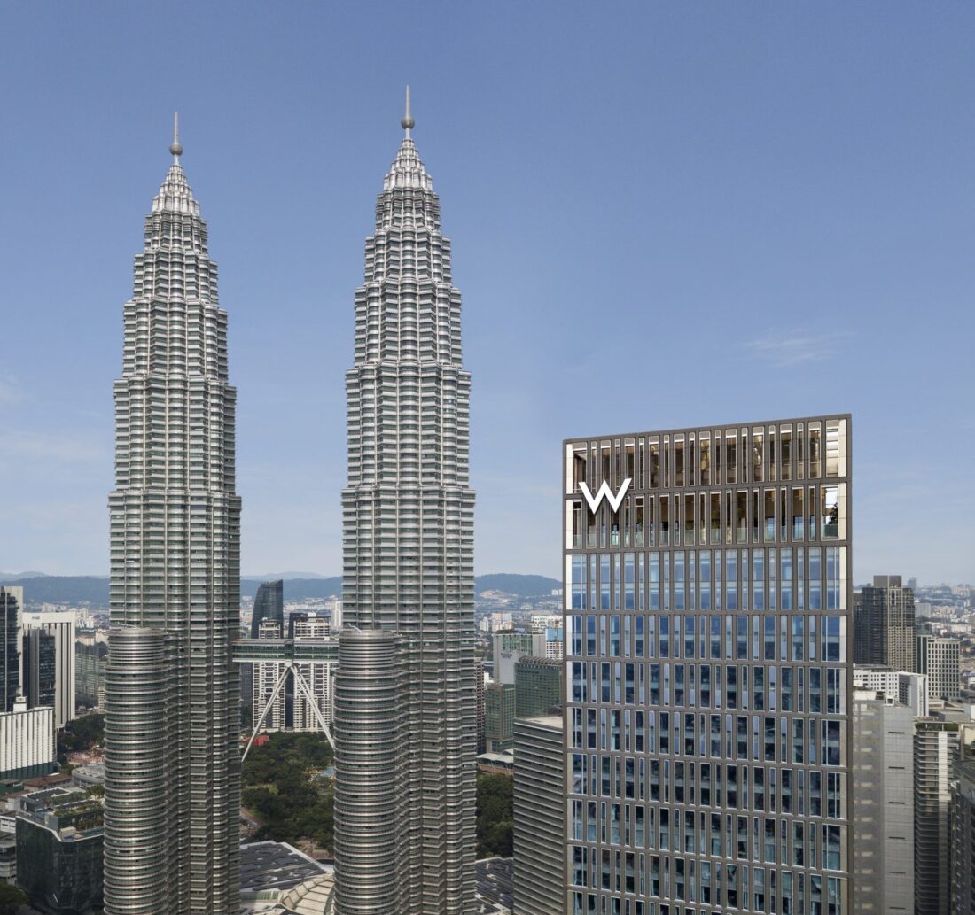 W Kuala Lumpur hotel tower beside the Petronas Twin Towers in the Kuala Lumpur skyline